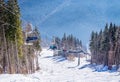 Picturesque snowy panorama of the Carpathian Mountains and a ski lift. Winter holidays in the mountains Royalty Free Stock Photo